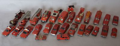 a lot of toy firetrucks that are on a table
