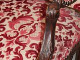 a close up of a red and white couch with a red and white pattern on it