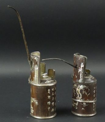 two small tins that are sitting next to each other