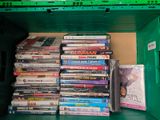 a lot of dvds in a green box on the shelf