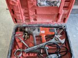 a tool box with tools inside of it on the floor