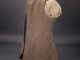 the back of a brown coat with a hood on a mannequin head