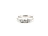 a close up of a diamond ring on a white background