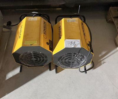 two yellow blowers sitting next to each other on the floor