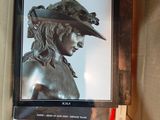 a picture of a box with a picture of a woman in a hat