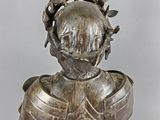 silver statue of a woman with a crown on her head