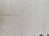 someone is writing on the wall of a building with graffiti on it