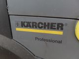 a close up of a machine with a yellow button on it
