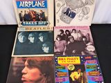 a group of records including jefferson airplane, the beatles, the beatles, and the beatles