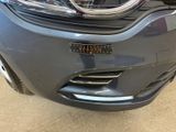 the front end of a gray car with its hood up
