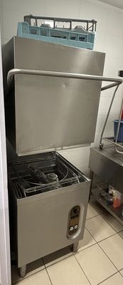 a kitchen with a sink, stove, and other appliances in it