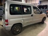 a silver van that is parked in a garage