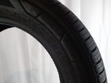 a close up of a tire on a white surface with a white background