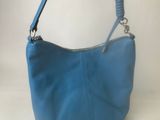 blue leather purse with chain strap on a white background