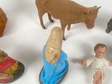 a lot of toy figurines that are on a table