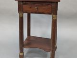 an old wooden table with a drawer on top of it