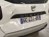 a close up of a white car with a number plate on it