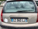 a car that is parked in a gravel lot