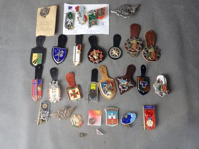 a lot of pins and badges on a table