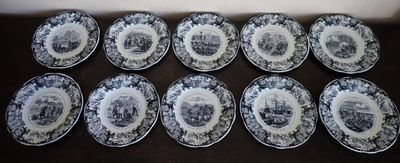 six blue and white plates with a picture of a man and a woman on them