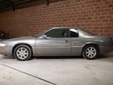 a silver car that is parked in a garage