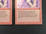 these are two cards from a card game with a picture of a woman