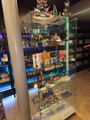 a glass display case in the middle of a store