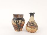 two vases sitting next to each other on a white surface