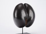 an image of a sculpture of an eggplant on a stand