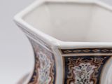 a vase that has a blue and white design on it