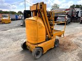 an image of a forklift parked in a parking lot