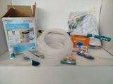 a white tub with a hose and other items on a shelf