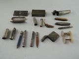 many different types of pens and pencils laid out on a table