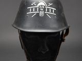 an image of a helmet on a mannequin head on a gray background