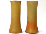 two vases that are sitting next to each other