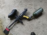 a paintball gun and a paintball gun on the ground