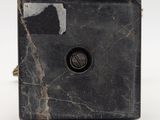 an image of a black marble clock on a white background