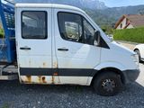 a white van that is parked on the side of the road