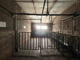 an image of a jail cell with bars and a door