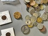 a lot of coins that are on top of a table