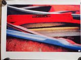 a picture of a picture of a red boat on the wall