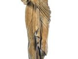 a statue of a woman standing on a pedestal