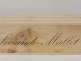a wooden box that has a name written on it