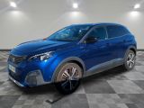 a blue car is parked in a room with a checkered floor