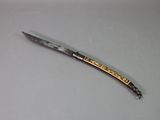 a knife that is laying on a table