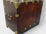 an image of a wooden chest with gold hearts on it