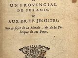 un vieux livre sur lequel figurent des inscriptions et l'image d'un oiseau