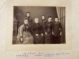 an old photo of a group of people posing for a picture