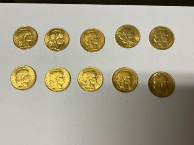 a close up of a bunch of gold coins on a table