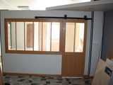 a room that has a window and a door in it
